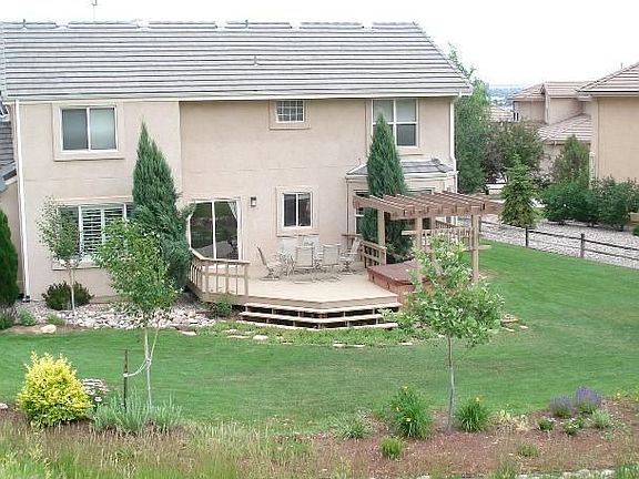 Rear view of home from hillside behind house.