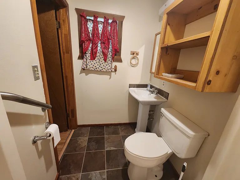 Master bedroom bathroom with pedestal sink.