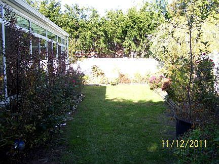 Flower garden, fenced yard