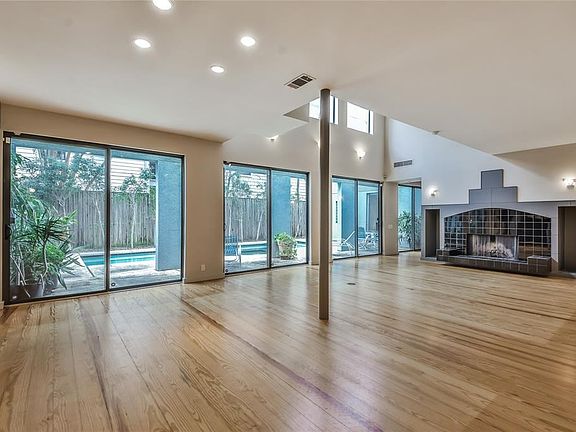 Beautiful open living/dinning space overlooking pool.
