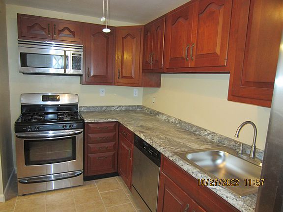 Kitchen- looking from back door to stainless steel appliances