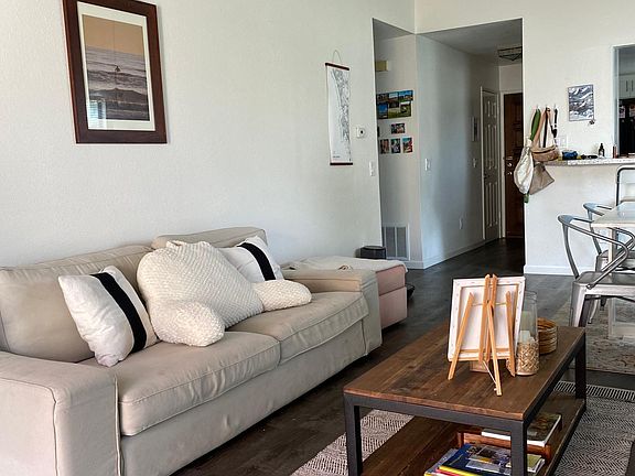 Living room (different furniture) facing entry door