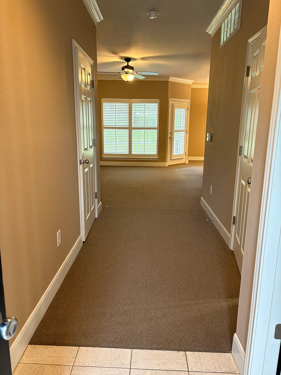 View from the front door down the hall to the living room. - 11617 Tomahawk Creek Pkwy #D