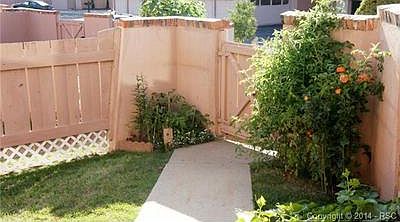 Gated fenced front private yard, grass maintained by HOA and ple