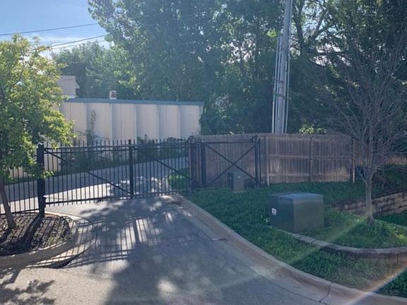 Back of unit gated parking and access to the garage