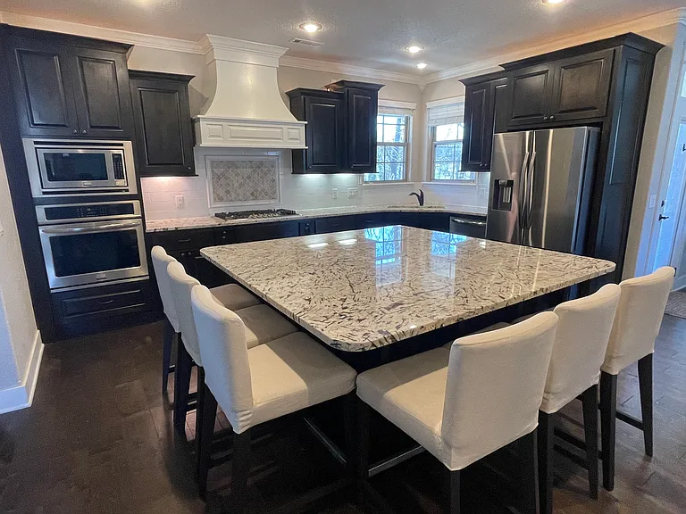 Chefs Kitchen with massive island with seating for 6