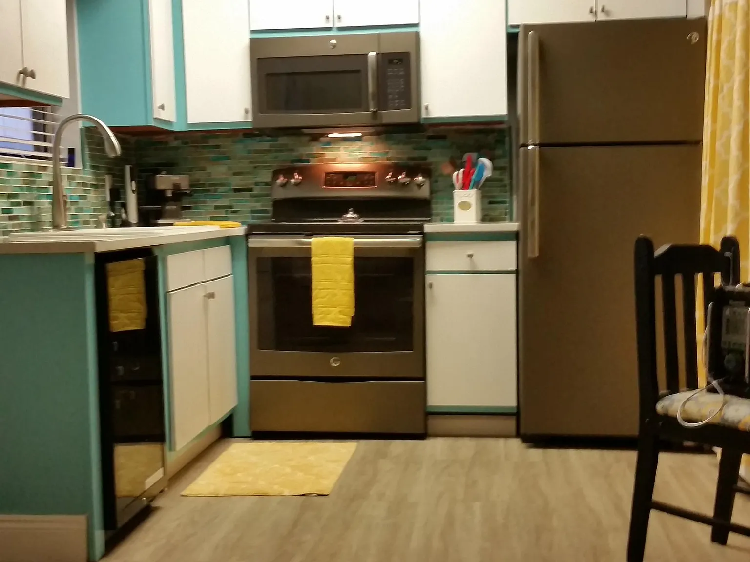 Slate GE appliances including hanging microwave and ice maker!! Garbage disposal also!