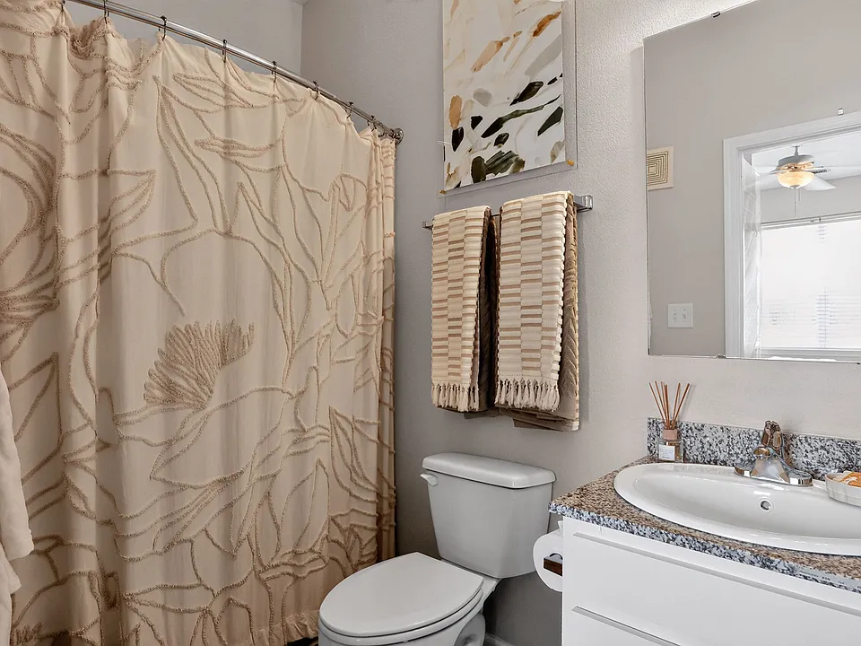 Relax in a Modern Bathroom with Granite Vanity at Ralston Apartments