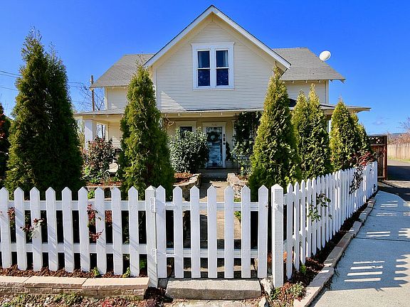 hand cut white picket fence