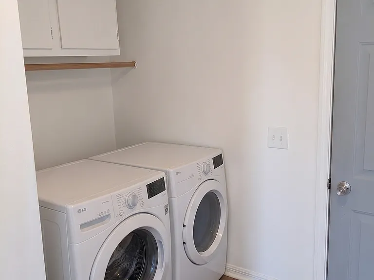 Laundry room (shown staged with new flooring)