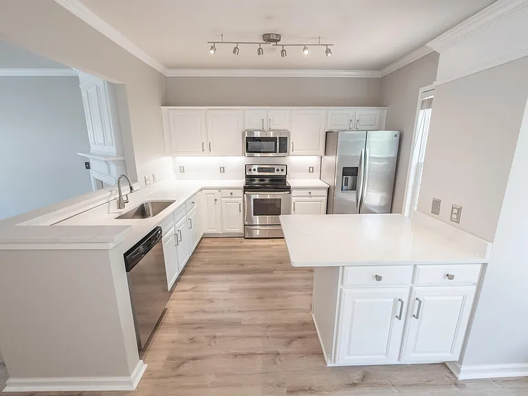 Under cabinet lights as well as premium updated track lighting
