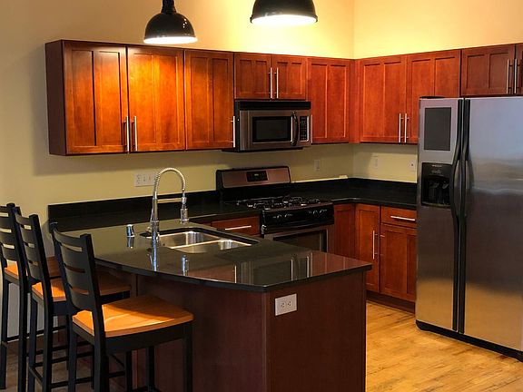 Custom Kitchen with cherry wood cabinets and granite counters.