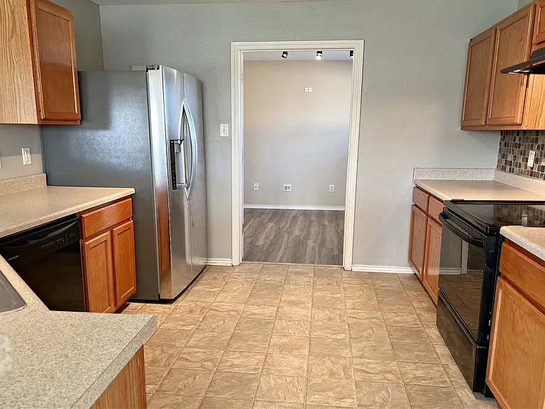 Kitchen from dinette toward dining room