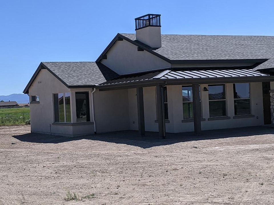 Front Porch with Metal Roof and Pavers- Living Room and Owner Suite have Great Views!