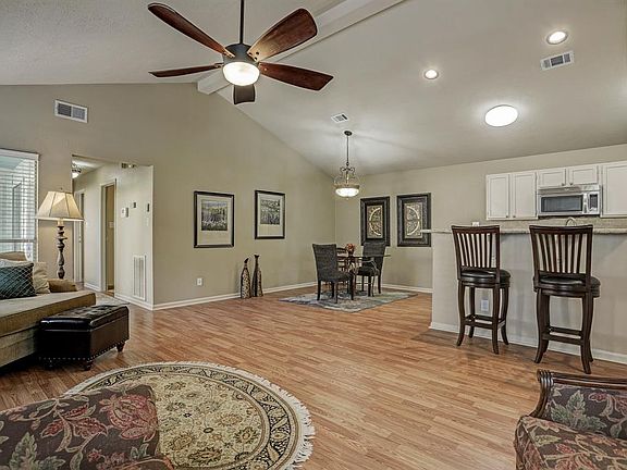 Enjoy open feel of kitchen, breakfast bar, dining area, and family room