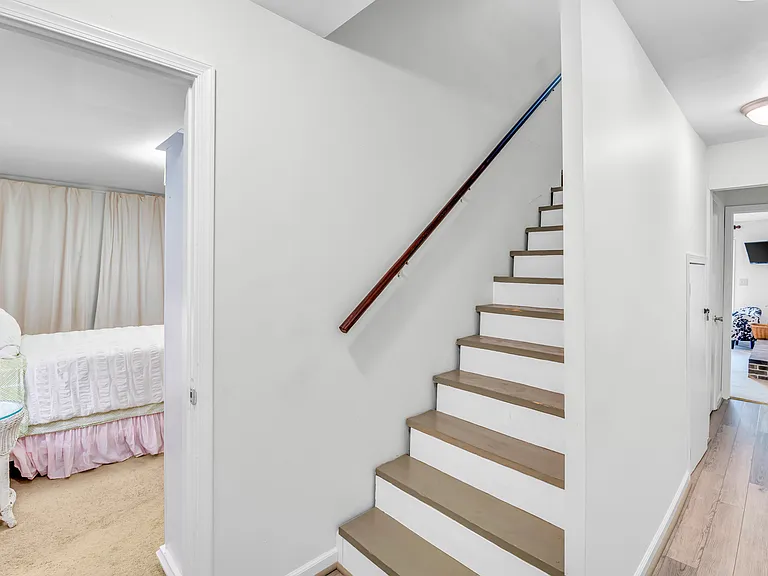 Stairs to lower level. Fourth bedroom to the left with twin beds or push together to make a full bed