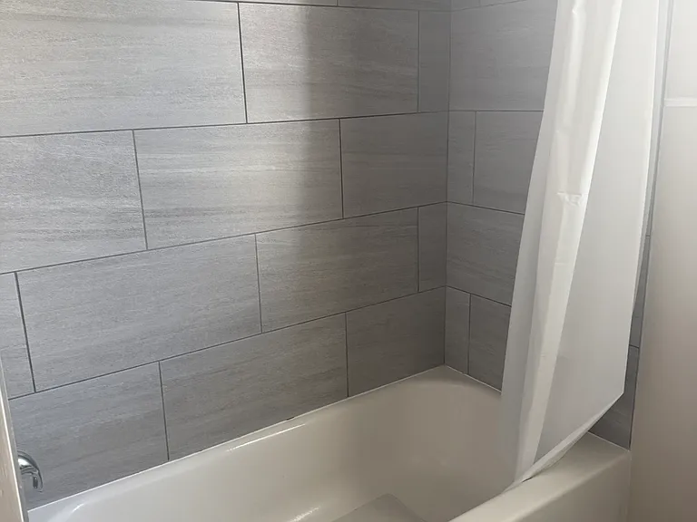 View of Shower/Tub with wall tile.