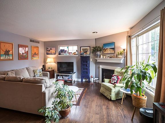 Living room, light and bright, with gas fireplace.
