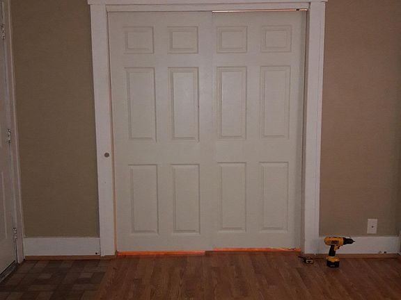 front room looking at sliding doors into master bedroom