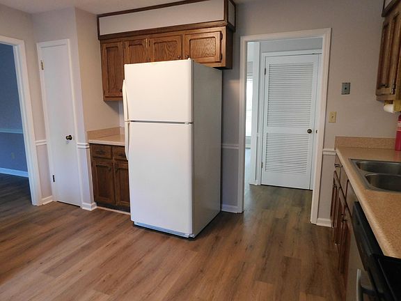 Kitchen with pantry to left. laundry doors on right