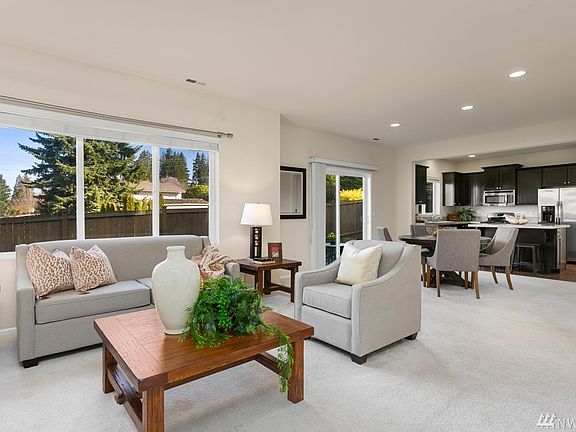 light and bright great room and kitchen area overlooks the private yard. 