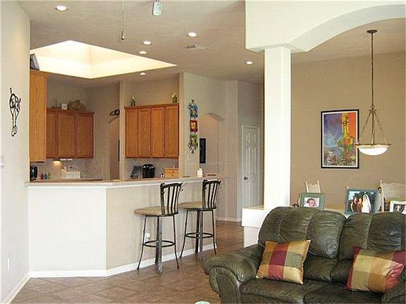 View from family room towards breakfast & kitchen areas. The skylight gives the kitchen lots of natural light.