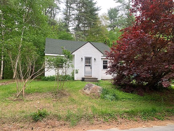Mudroom, front-center, Living room on left of mudroom, and kitchen on right of mudroom.