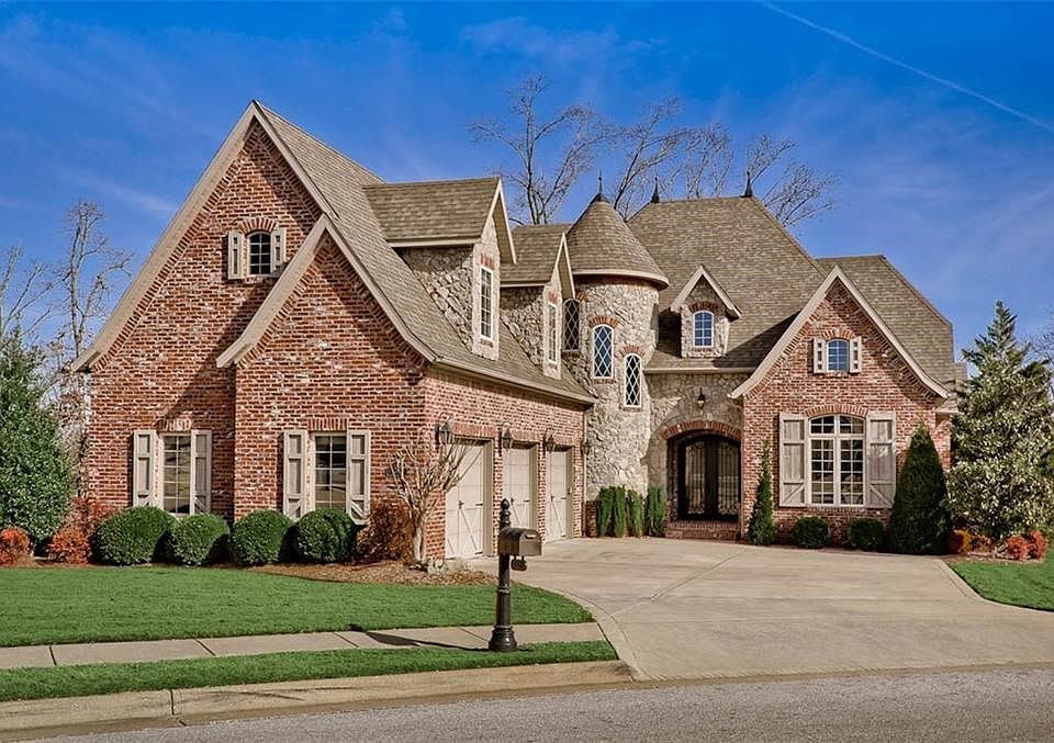Gorgeous, Classic Carriage House Curb Appeal punctuates this Stunning Home on the Golf Course...