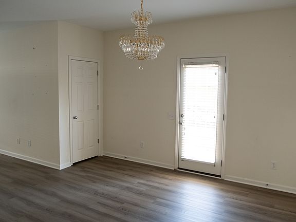 Dinning area with the view of the exit to the side of the building.