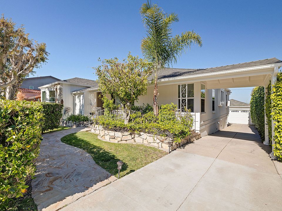 Front of home. Off-street parking and easy access to front door from carport.