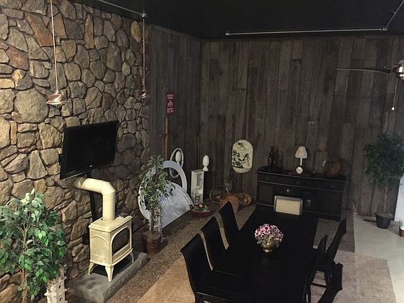 View of the dining room from the loft
						:
						Enjoy meals next to the fireplace. Textures add warmth and elegance.