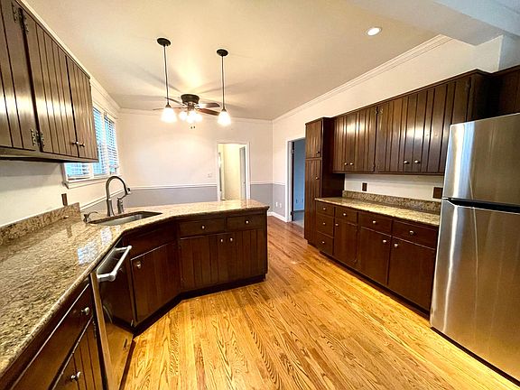 Kitchen with granite countertops and stainless steel appliances.