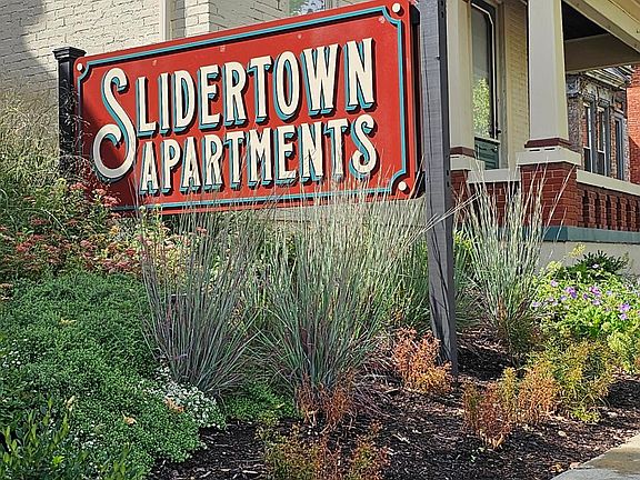 Slidertown Apartments sign on Wayne Avenue.
Apartment 102 in background.