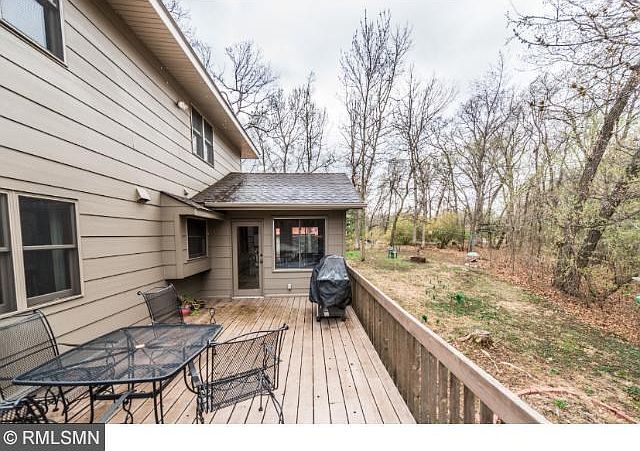 Great deck area off four season porch with stairs leading down to yard.