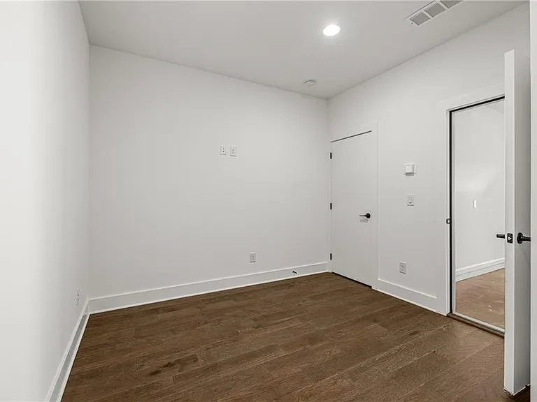 Flex Space / Den (Note: Actual unit has light wooden floors and upgraded fixtures / appliances)
