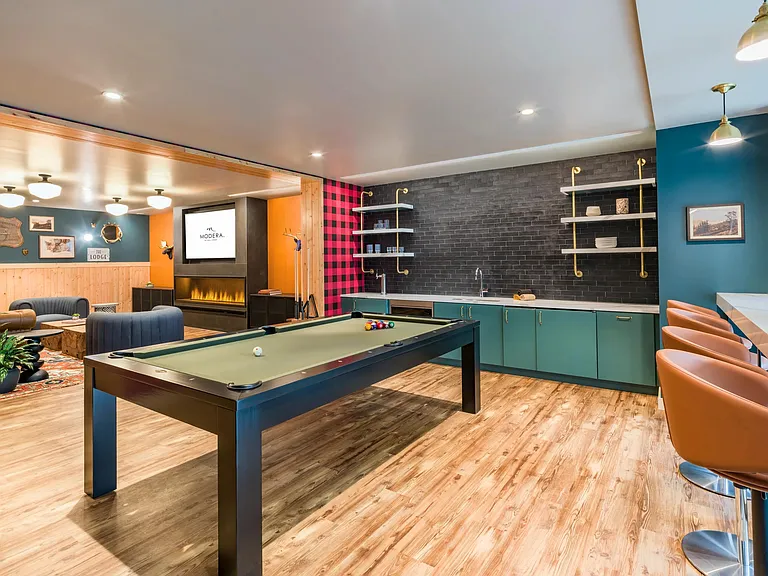 Relax in the lodge lounge with a wet bar, shuffleboard, board games, and foosball.
