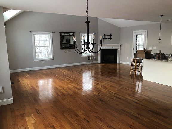 Open concept living area with cathedral ceilings