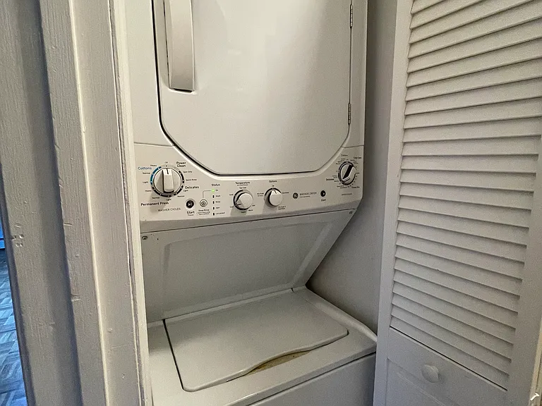 Washer and dryer located in the full bathroom