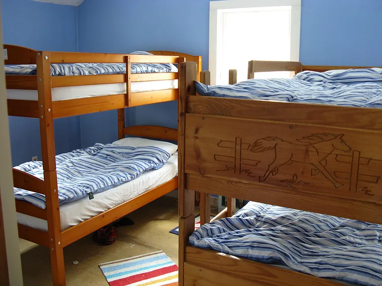 upstairs kids room with 4 twin bunks and we just added a nice full bed to it