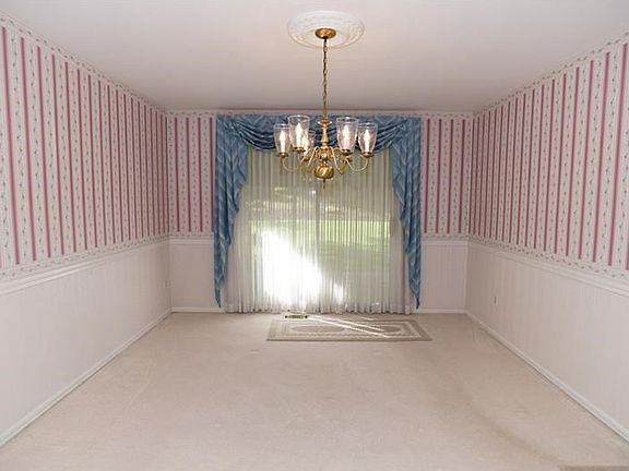 Spacious dining room with glass doors to the covered patio and back yard