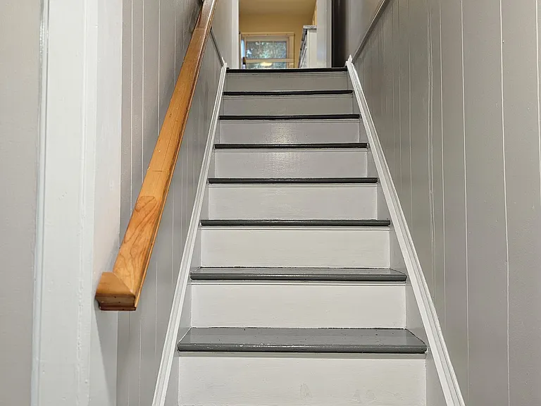 Basement stairs leading to kitchen