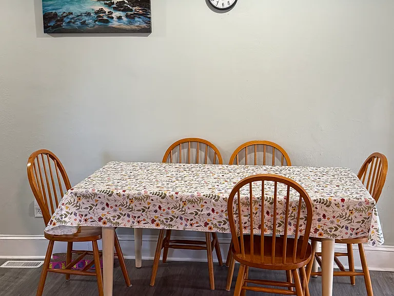 This table is in the end of the kitchen.