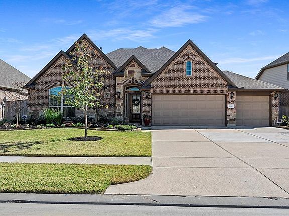 This stunning home boasts and upgraded professional landscape package and a three car side by side garage.