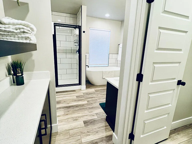 Seperate soaker tub and tiled shower. Also water closet.