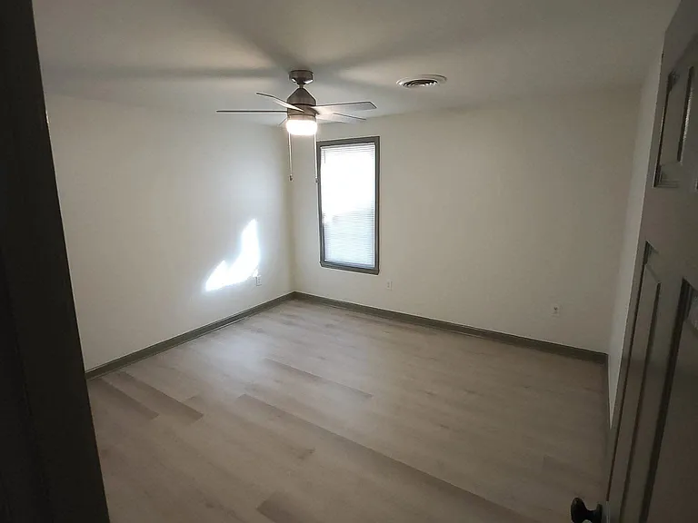 LARGE BEDROOM WITH CEILING FAN
