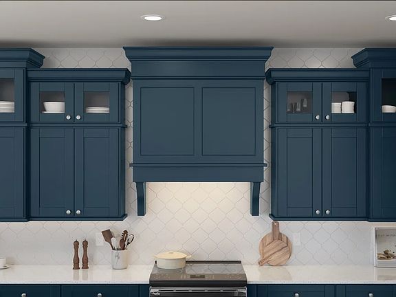 Kitchen with deep blue cabinets