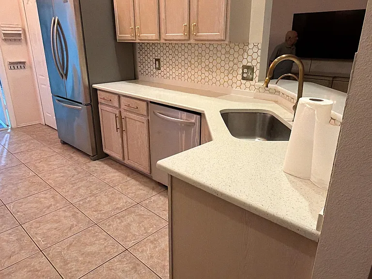 Kitchen has tall ceilings, large window, shelved pantry, stainless steel appliances and granite countertops. It is overlooking Dining Room and family room. Perfect set-up for entertaining or for family!