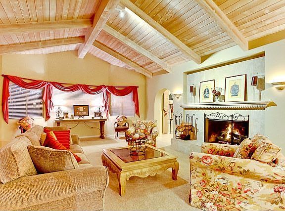 Formal Living Room boast Open Beam Ceilings and  Fireplace 