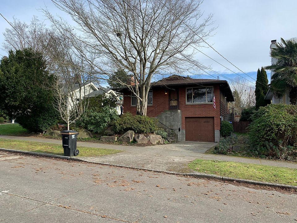 6020 32nd Ave NE Mid-Century Modern Home. Well insulated, oil heat and off street parking on a flat, quiet Bryant street.