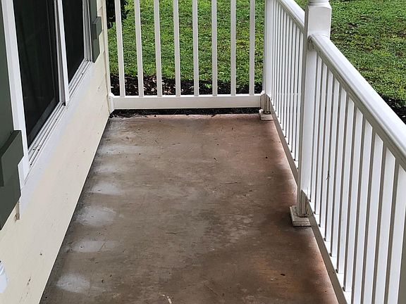 Classically Southern, this front porch invites you sit and relax in this quiet neighborhood.